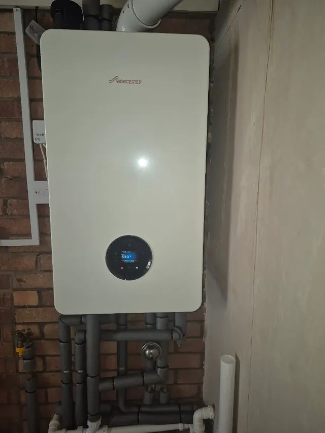 Worcester Bosch boiler with the pipework below it insulated